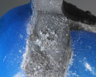 Corrosion at Metal-Glass Interface